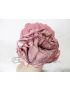 Bonnet à fleur rose pastel.