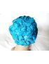 Bonnet à fleur bleu tirquoise.